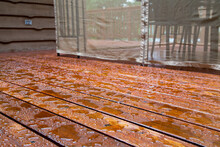 Water Beads Up On A Freshly Sealed Wood Deck After A Morning Rainstorm At The Cottage.