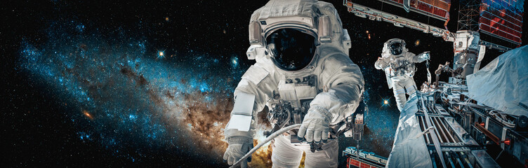 Wall Mural - Astronaut spaceman do spacewalk while working for space station in outer space . Astronaut wear full spacesuit for space operation . Elements of this image furnished by NASA space astronaut photos.