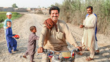 Fototapeta  - a farmer is riding a bike and feeling happy in a village