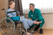 © lukyeee_nuttawut - Orthopedic doctor examines and checking knee's elderly woman patient on wheelchair at hospital