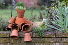Terracotta Plant Pots Arranged To Make A Quirky Flower Pot Man.