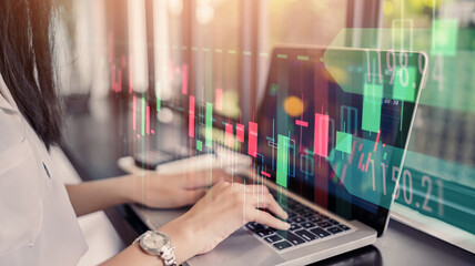 Wall Mural - businesswoman trader using laptop computer technology data analysis graph on forex foreign stock mar