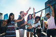 © oneinchpunch - Group of friends having fun on the rooftop of a beautiful penthouse