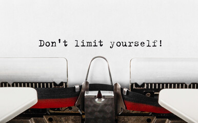 Wall Mural - Text Don't limit yourself typed on retro typewriter