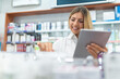 © Minerva Studio - Pharmacist checking the inventory in a pharmacy