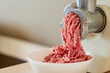 mince the meat with an electric meat mincer