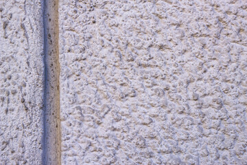 Plastered rough wall texture. City surface background. Grey decorative textured backdrop.