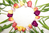 Fototapeta Tulipany - Floral background with copy space. Flat-lay frame of tulips. Womens day, mothers day greeting card