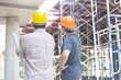 Three engineers working in a construction site