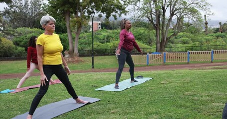 Wall Mural - Multiracial people doing yoga together outdoor at park - Multi generational, healthy lifestyle and sport concept