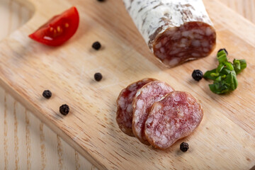 Wall Mural - Homemade Italian salami on wooden cutting board