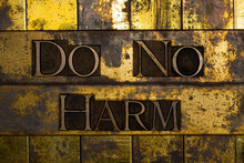 Do No Harm Letter Art On Vintage Textured Grunge Copper And Gold Steampunk Background