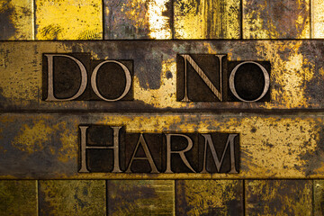 Do No Harm letter art on vintage textured grunge copper and gold steampunk background