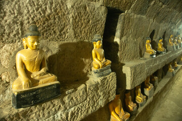 Golden Buddha statue in the ancient temple, Mrauk U Myanmar