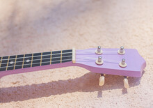 Fretboard With Strings Of An Old Lilac Guitar In Bright Sunlight