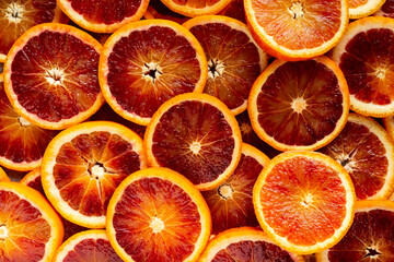 Wall Mural - Fresh Red Blood Oranges slices. background, texture.