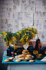 Wall Mural - biscuits with lemon with a bouquet of mimosa.style vintage