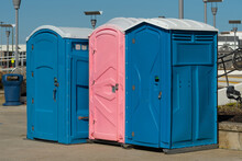 Row Of Public Portable Mobile Toilets On The Street Outdoor