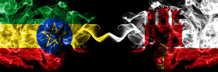 Ethiopia, Ethiopian vs British, Britain, Gibraltar smoky mystic flags placed side by side. Thick colored silky abstract smoke flags.