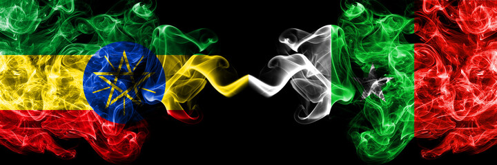 Ethiopia, Ethiopian vs Casamance, Senegal  smoky mystic flags placed side by side. Thick colored silky abstract smoke flags.