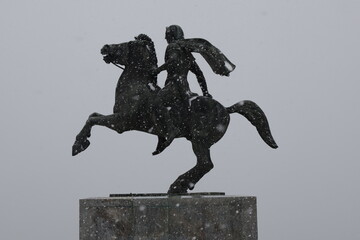 Statue of Alexander the Great monument in Thessaloniki, Greece, on a snowy day