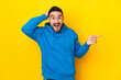 © luismolinero - Young caucasian handsome man isolated on yellow background surprised and pointing finger to the side