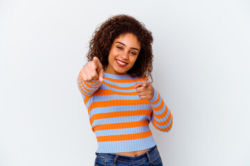 Wall Mural - Young african american woman isolated on white background cheerful smiles pointing to front.