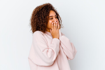 Wall Mural - Young african american woman isolated on white background laughing about something, covering mouth with hands.