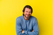 © Asier - Middle age caucasian man isolated on yellow background laughing and having fun.