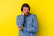 © Asier - Middle age caucasian man isolated on yellow background massaging elbow, suffering after a bad movement.