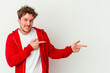 © Asier - Young caucasian man isolated on white background pointing with forefingers to a copy space, expressing excitement and desire.