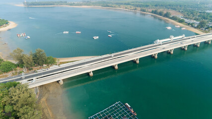 Aerial top view drone shot of bridge with cars on bridge road image transportation background concept Located at Sarasin bridge Phuket thailand