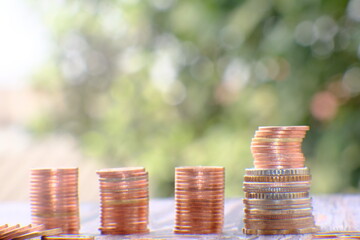 Poster - Stacks of gold money coin on table background and concept saving money, business growth strategy of money concept, advertising coins of finance and banking