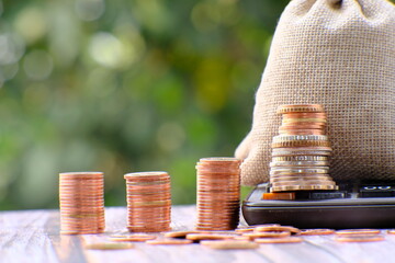 Stack of coin on table background and business or finance saving money