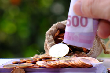 Poster - Stacks of gold money coin on table background and concept saving money, business growth strategy of money concept, advertising coins of finance and banking