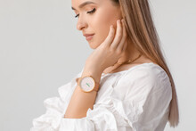 Woman With Stylish Wrist Watch On White Background
