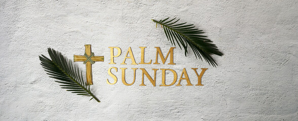 Wall Mural - Palm sunday background. Cross and palm on grey background.