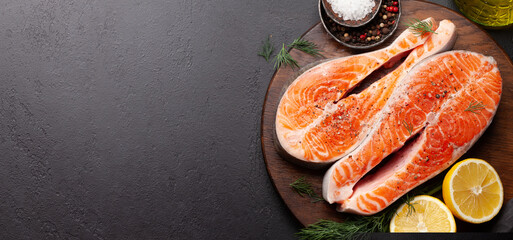 Fresh raw salmon cooking. Fish steaks with herbs and spices