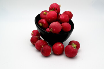 Sticker - close-up of red radish in a black bowl