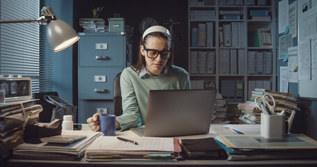 Wall Mural - Stressed woman working in the office