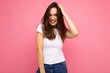 © Ivan Traimak - Portrait of positive cheerful fashionable woman in casual t-shirt for mock up isolated on pink background with copy space