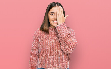 Sticker - Young beautiful woman wearing casual clothes covering one eye with hand, confident smile on face and surprise emotion.