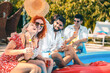 © Zoran Zeremski - Group of friends having fun at summer vacation enjoying at poolside party.