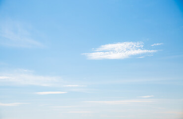 Blue sky background with white fluffy clouds in sunny day.