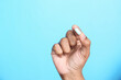 © Towfiqu Barbhuiya  - Close up of man hand holding pills with copy space