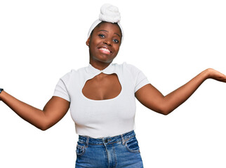 Poster - Young african woman with turban wearing hair turban over isolated background smiling showing both hands open palms, presenting and advertising comparison and balance