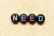 © bankrx - Black color round alphabet letter block in word need on wood background