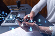 © VideoFlow - Hands of hr specialist browsing social networks in the Internet in smart phone to find the best candidates to hire international team. Concept of success. Media hologram icons.