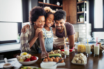 Wall Mural - happy family cooking together food in the kitchen