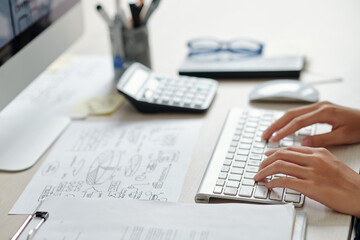 Wall Mural - Hands of businesswoman working on computer at office desk, selective focus